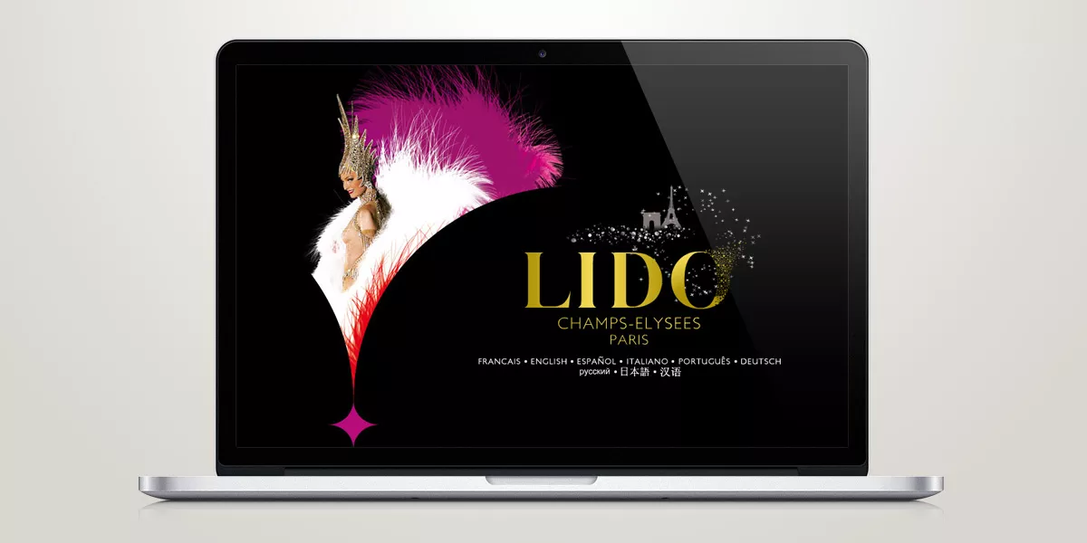 Page d'accueil du site internet multilingue du Lido de Paris sur ordinateur portable, création Nowaxx